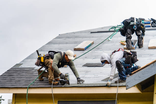 Professional Gutter Installation technician working in Rossville, MD